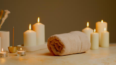 Still-Life-Of-Lit-Candles-With-Dried-Grasses-Incense-Stick-And-Soft-Towels-As-Part-Of-Relaxing-Spa-Day-Decor-2